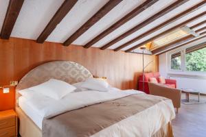 Postel nebo postele na pokoji v ubytování Hotel Beau Rivage