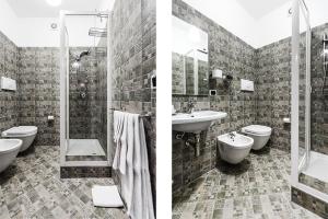 a bathroom with a sink and a toilet and a shower at Castaldi house in Milan