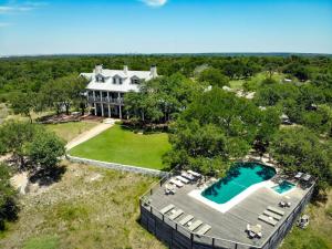 an aerial view of a large house with a swimming pool at Sage Hill Inn & Spa in Kyle