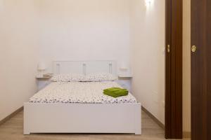 Posteľ alebo postele v izbe v ubytovaní Le casette di nonno Pippo