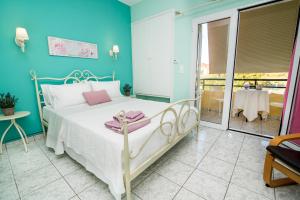 Postel nebo postele na pokoji v ubytování Villa Sophia