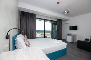 Postel nebo postele na pokoji v ubytování Hotel H pe plaja Belona + 25 fotografií