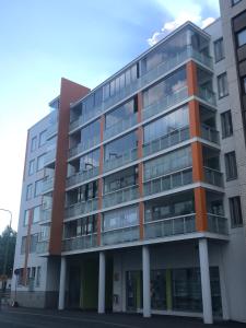 an apartment building with an orange and gray at Antintorni Suite 17 in Pori