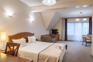 Posteľ alebo postele v izbe v ubytovaní Hotel Nosalowy Dwór