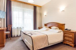 Posteľ alebo postele v izbe v ubytovaní Hotel Nosalowy Dwór