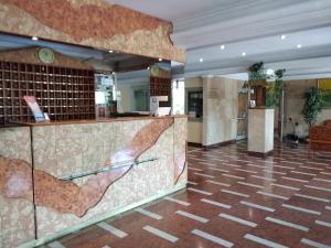 a lobby of a hotel with a reception counter at Hotel Nap in Budapest