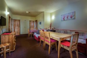 A television and/or entertainment centre at Guest House Privat Pod Lesom