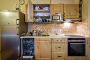 A kitchen or kitchenette at Guest House Privat Pod Lesom
