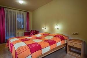 A bed or beds in a room at Guest House Privat Pod Lesom