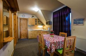 A kitchen or kitchenette at Guest House Privat Pod Lesom