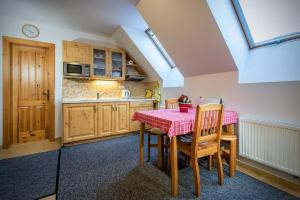 A kitchen or kitchenette at Guest House Privat Pod Lesom