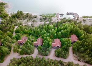 an aerial view of a house with trees and water at Cottage "Rådjuret" in Finström