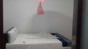 Postel nebo postele na pokoji v ubytování Suman Beach Rooms