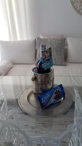 a table with three baskets on top of a couch at Apartament Leśny in Dziwnówek