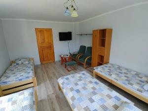 Łóżko lub łóżka w pokoju w obiekcie Noclegi pod Klimczokiem