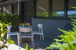 a small table and chairs on a patio at FeelFree STAYS Basoa in Donostia-San Sebastián