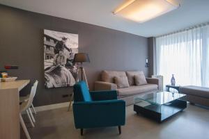 a living room with a couch and a table at FeelFree STAYS Basoa in Donostia-San Sebastián