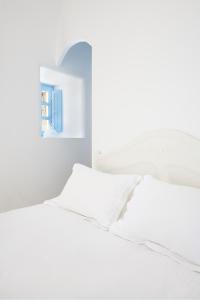Voodi või voodid majutusasutuse Pantelia Suites toas