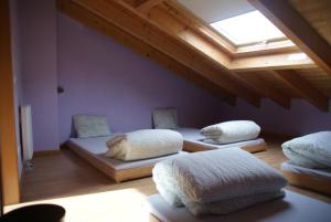A bed or beds in a room at Refugi Casa Canelo