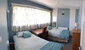 Voodi või voodid majutusasutuse Farnham House toas