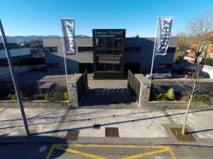 a building with two flags in front of it at FeelFree STAYS Basoa in Donostia-San Sebastián