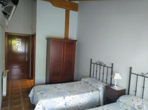 Łóżko lub łóżka w pokoju w obiekcie Casa Rural GAUBEKA