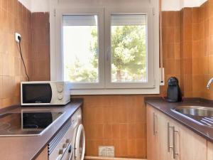 Køkken eller tekøkken på Rentalmar Margarita