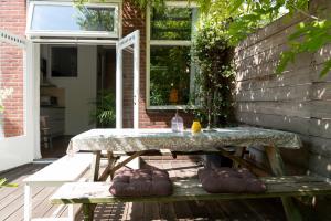 a stone table on a patio with at Studio Jan Steen in Amsterdam
