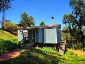 a tiny house on the side of a hill at Sequoia Resort in Badger