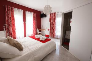 Postel nebo postele na pokoji v ubytování Les villas du triangle - chambres d'hôtes
