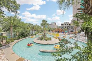 an image of a water park with people in inflatable tubes at Sand Dunes Resort and Suites in Myrtle Beach