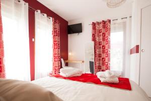 Postel nebo postele na pokoji v ubytování Les villas du triangle - chambres d'hôtes