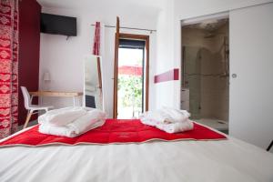 Postel nebo postele na pokoji v ubytování Les villas du triangle - chambres d'hôtes