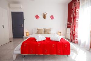 Postel nebo postele na pokoji v ubytování Les villas du triangle - chambres d'hôtes