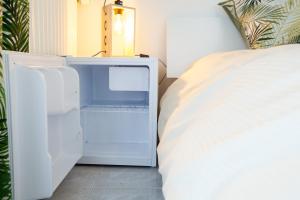 Postel nebo postele na pokoji v ubytování Les villas du triangle - chambres d'hôtes