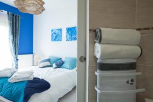 Postel nebo postele na pokoji v ubytování Les villas du triangle - chambres d'hôtes