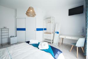 Postel nebo postele na pokoji v ubytování Les villas du triangle - chambres d'hôtes