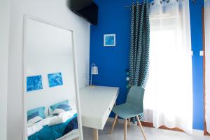 Postel nebo postele na pokoji v ubytování Les villas du triangle - chambres d'hôtes