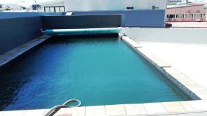 a pool of blue water on top of a building at Unit 46 @ 77 on Independence in Windhoek