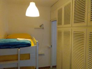 a bedroom with a bunk bed and a light at casa fiorella in San Bernardino