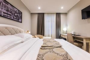 Postel nebo postele na pokoji v ubytování Hotel Khokhobi Old Tbilisi