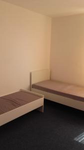 En eller flere senge i et værelse på Óbudai Apartman - Sziget Festival