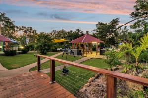 a wooden deck with a picnic table and a park at Discovery Parks - Airlie Beach in Airlie Beach +22 photos