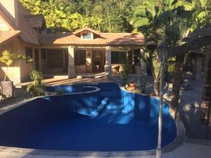 a swimming pool in the backyard of a house at Paraíso Contemporâneo in Santo Amaro da Imperatriz