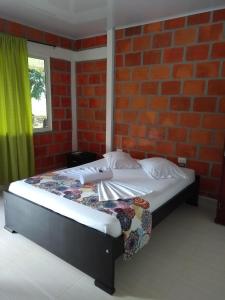Llit o llits en una habitació de Hotel Campo Verde