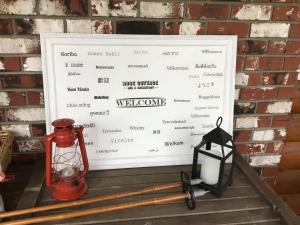 a picture of a sign with a baseball bat and a lantern at Rose Cottage Bed & Breakfast in Valemount