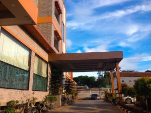 a building with awning on the side of it at Grand Krakatau Hotel Serang in Serang