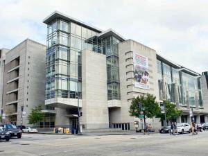 a building on a street with cars parked in front of it at Convention Center/Logan Circle Large Cozy House. in Washington