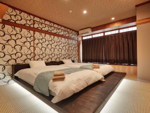 Ένα ή περισσότερα κρεβάτια σε δωμάτιο στο ADAN RESORT Yuhina