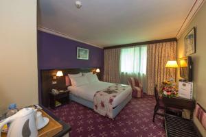 Cama o camas de una habitación en Hotel Toubkal